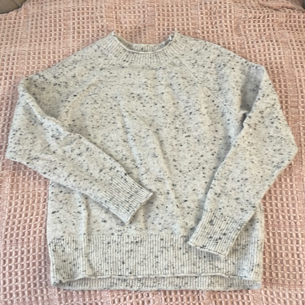 XS white with black speckled sweater.
